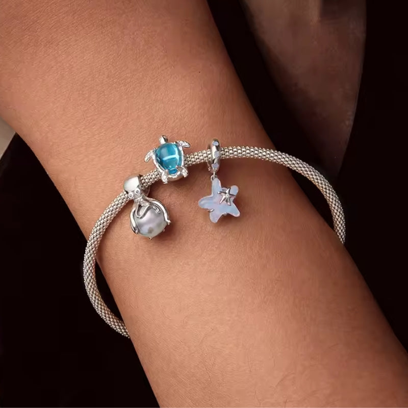 Schildkröten Charm mit filigranen Schildkrötenmotiven – inspiriert von der Unterwasserwelt. Perfekt für Taucher, Surfer & Meeresfans. 🌊🐢✨